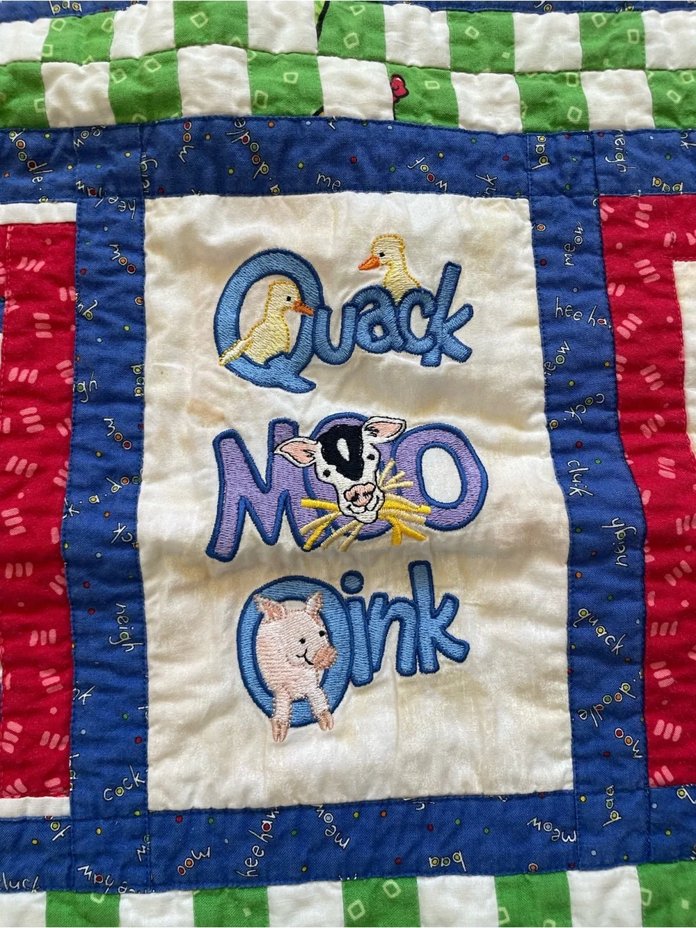 Quack, Moo, Oink quilt with farm animals and 'Quack, Moo, Oink'